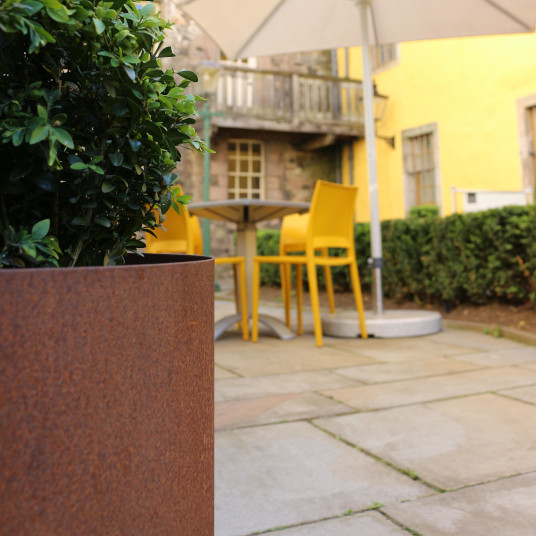 Outdoor planters located around the Edinburgh Museum seating area